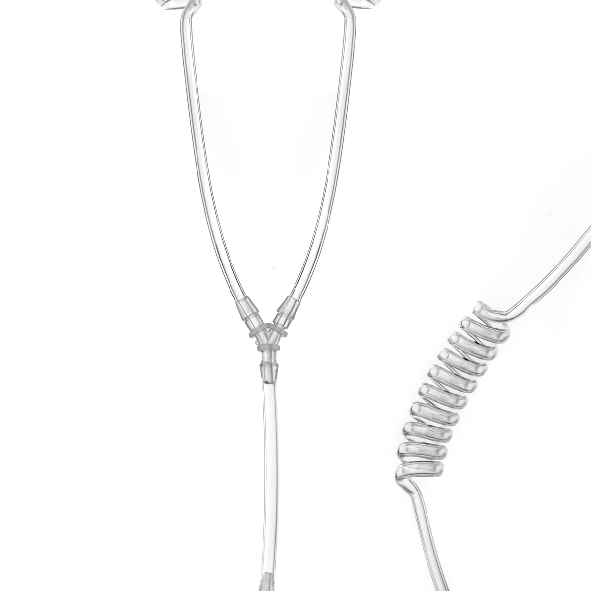 Transparent medical tubing and connector pieces on a plain white background, showing a Y-joint and coiled section.