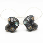 Pair of ACS earbud headphones on a white background