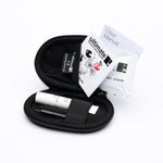 Black carrying case with a handheld device and user manual on a white background