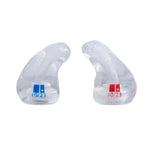 Clear earbud tips with date labels on a white background