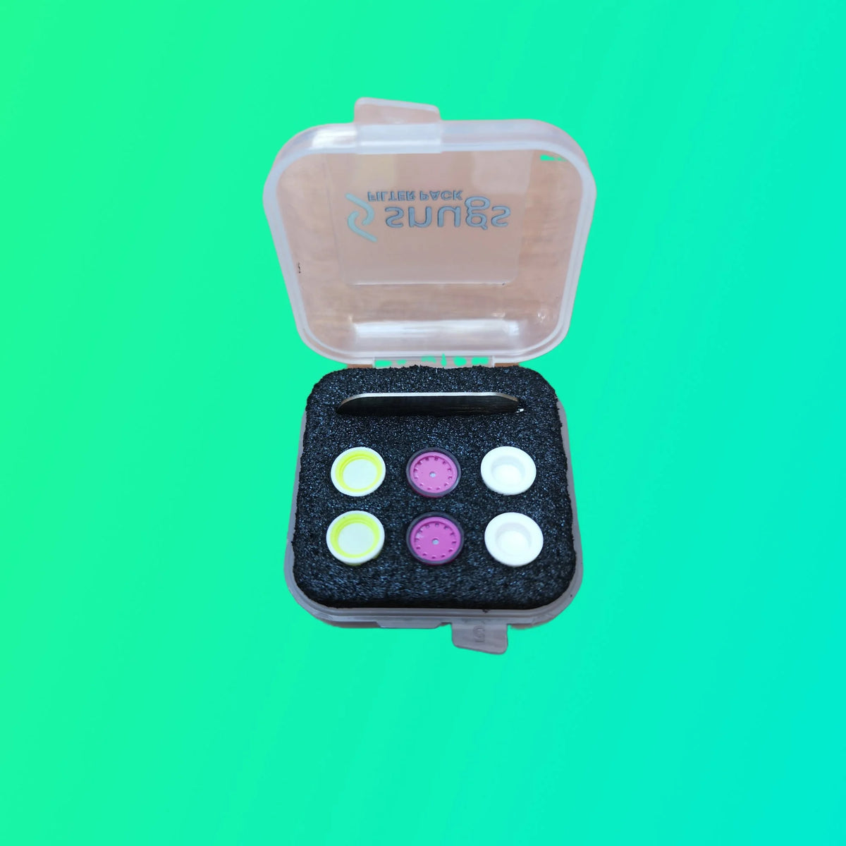 Small open box with colorful buttons on a green background