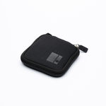 A small black zippered neoprene pouch with a square logo patch, shown on a clean white background.