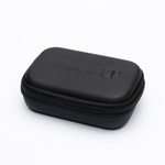 A black zippered hard case with a matte finish and embossed branding, photographed on a clean white background.