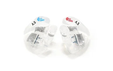 Two clear in-ear monitors with silver internal components and small blue and red logo stickers, labeled 'A.S' on a plain white background.