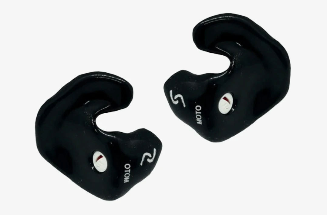 black earplugs with moto written on them on a white background