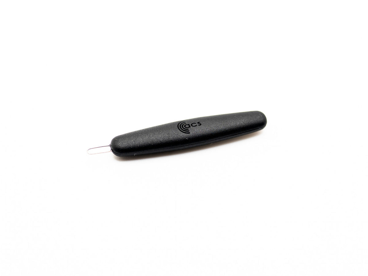 Black ear wax pick on a white background